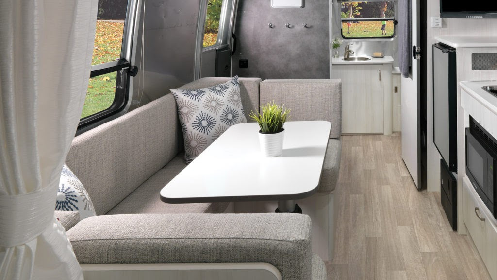 Airstream-Bambi-22FB-Dune-Interior-Dinette-and-Conversion-Bed-Featured-Hotspot-1024x576